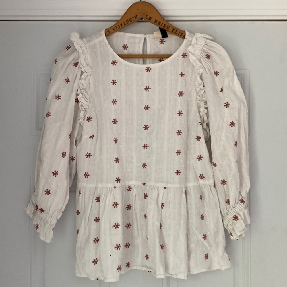 White blouse with rose details